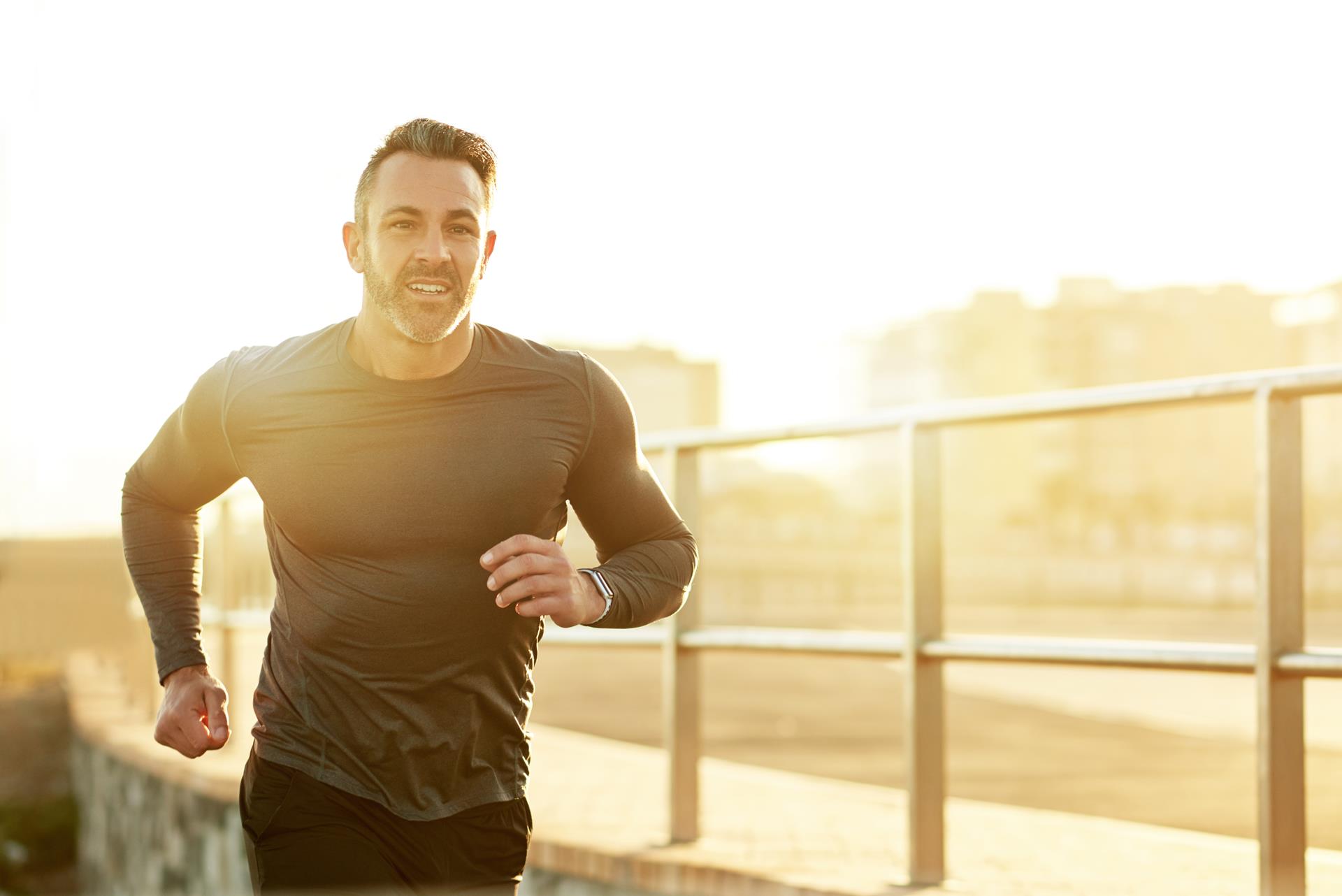Active man running outdoors after receiving urologic care